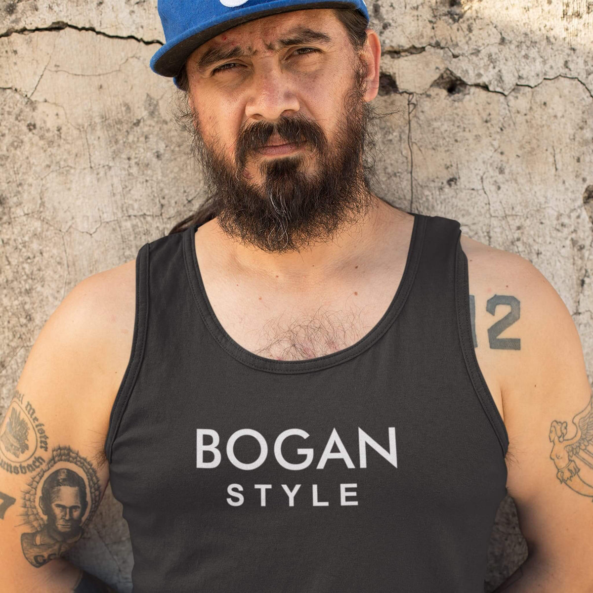 Bearded guy wears black singlet with Bogan Style printed on front.