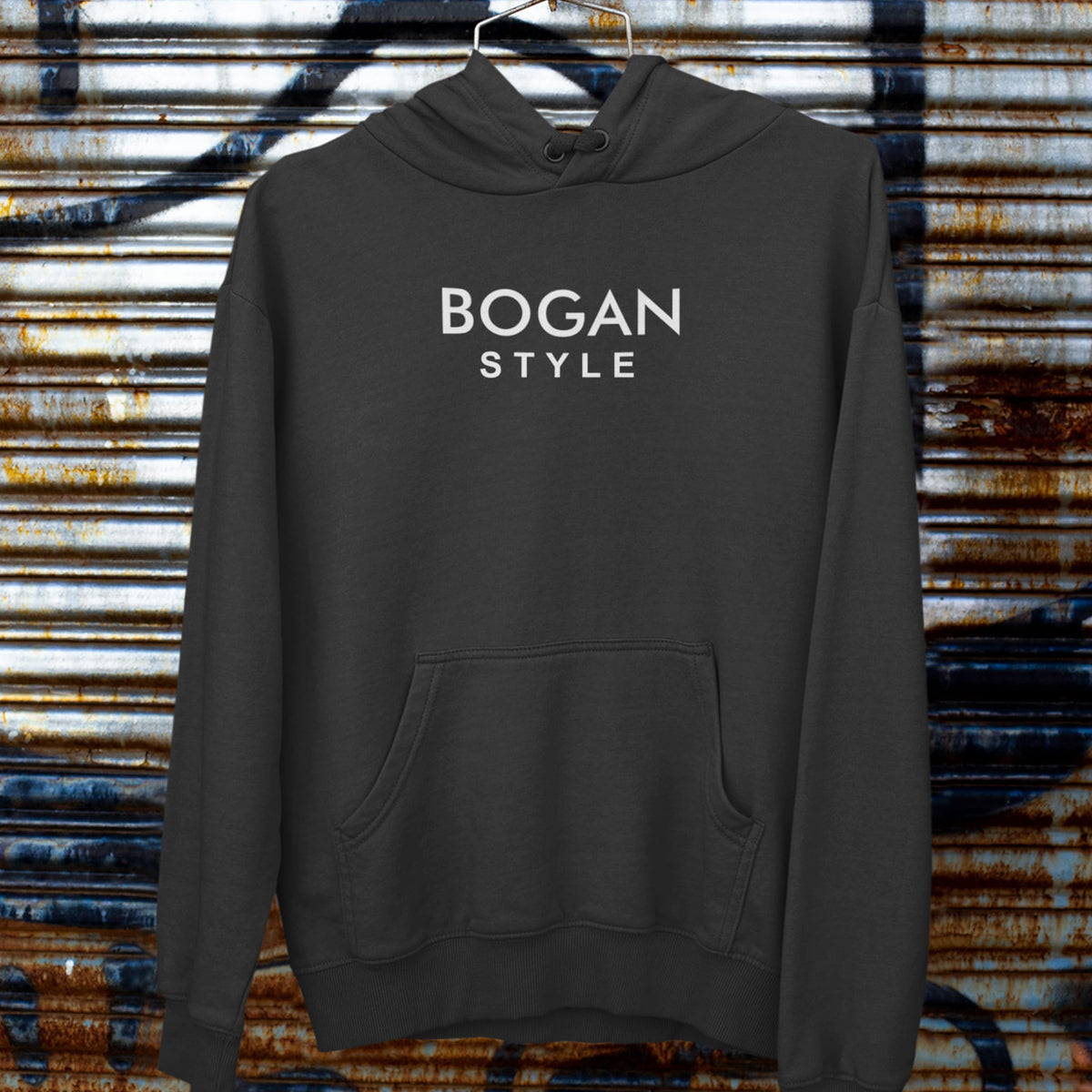 Black hoodie on a coat hanger with Bogan Style printed on the front