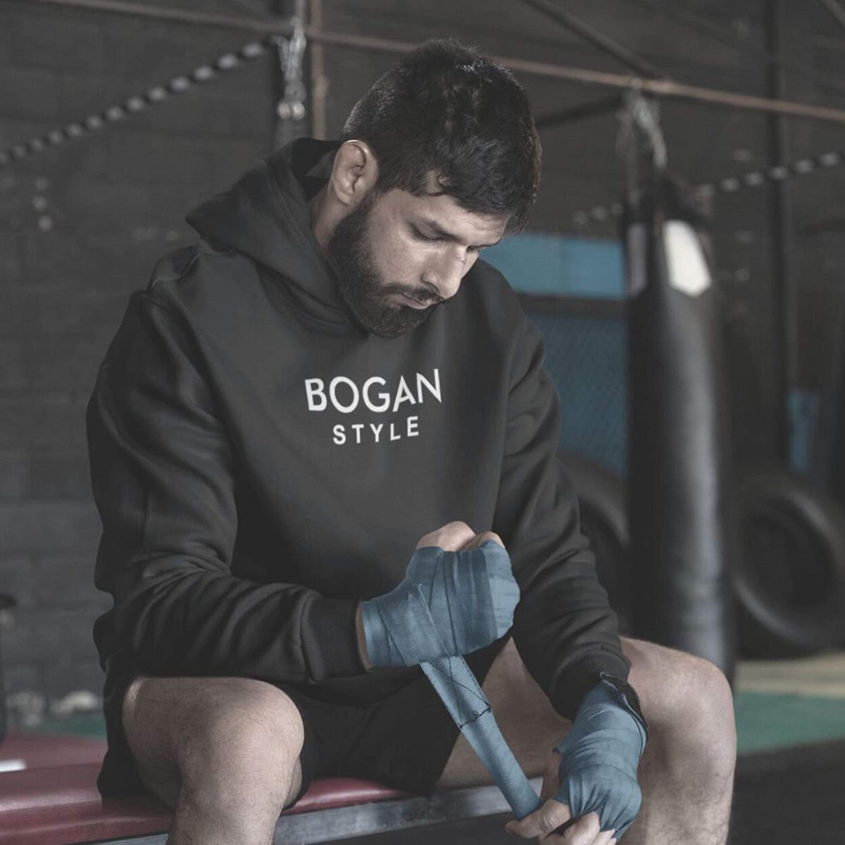 Man at boxing gym wearing black Bogan Style hoodie