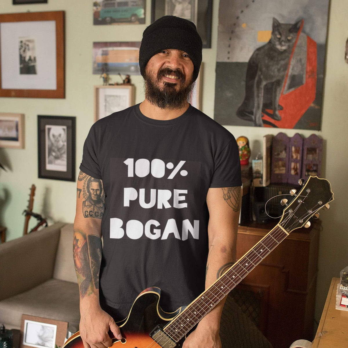 Man playing guitar wears black t shirt with 100% Pure Bogan on the front