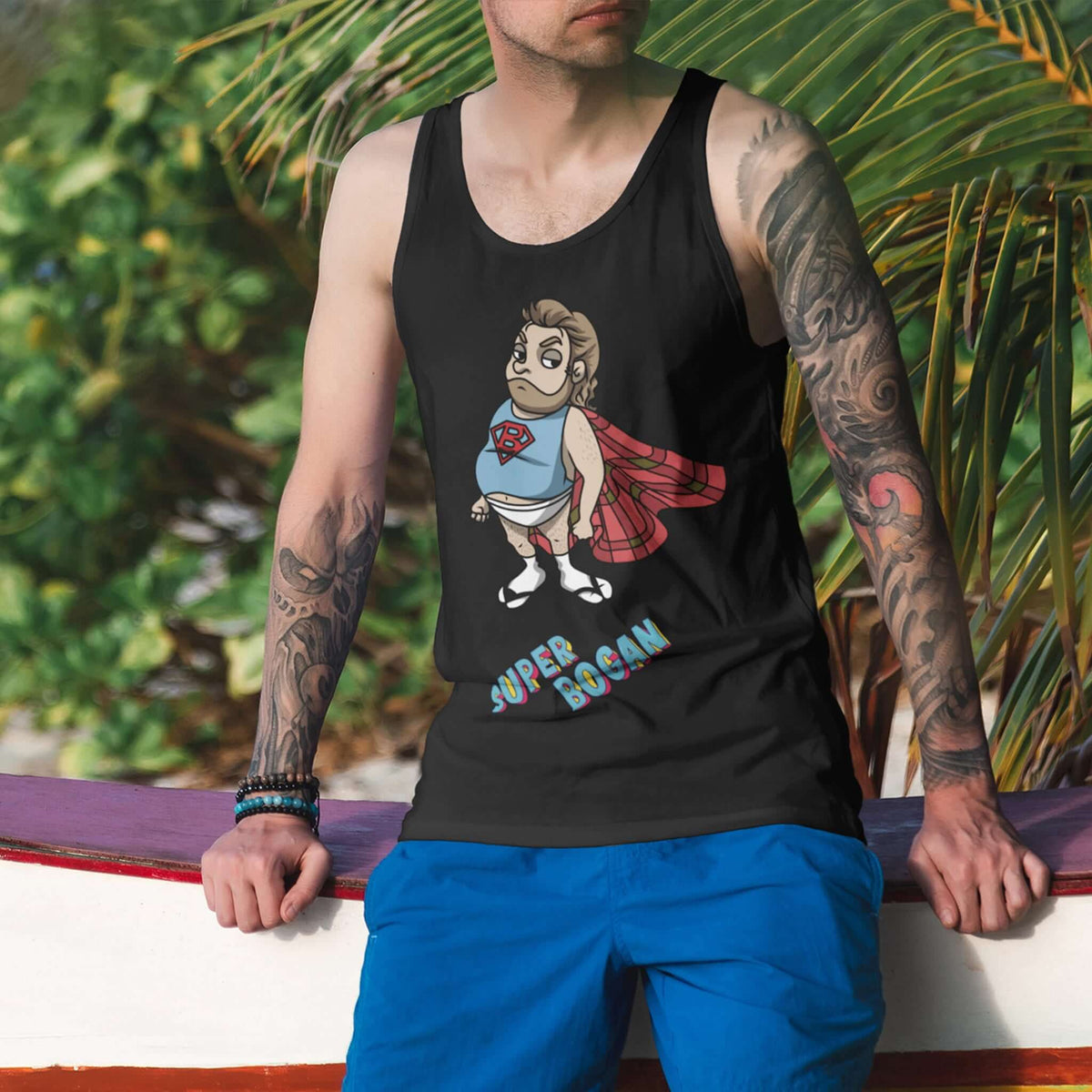 Man with tattoos wears black tank with Super Bogan design