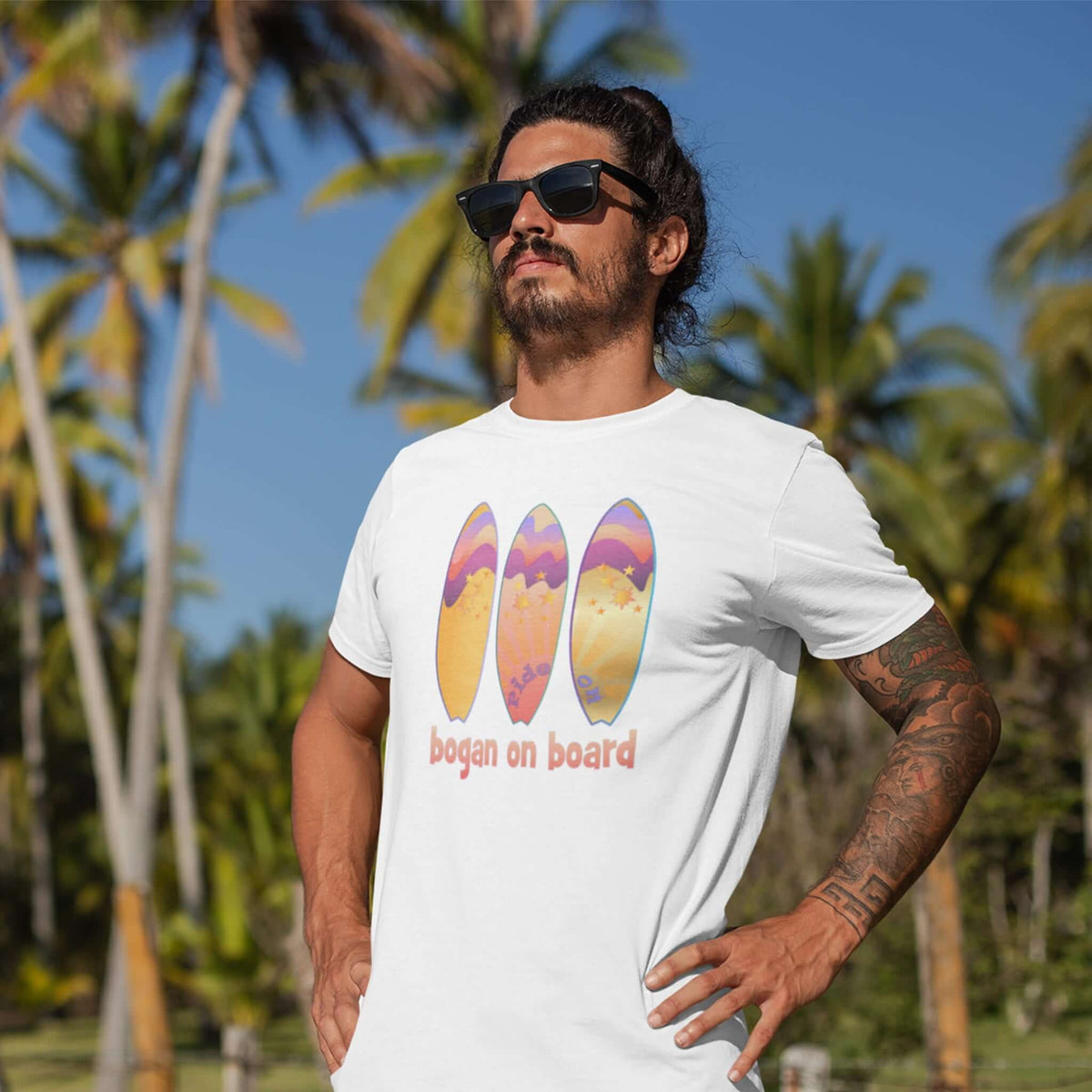 Man-wearing-white-tee-with-surfboard-design