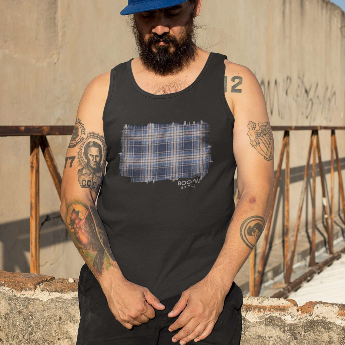 Man with tattoos wearing black tank top with flanno design